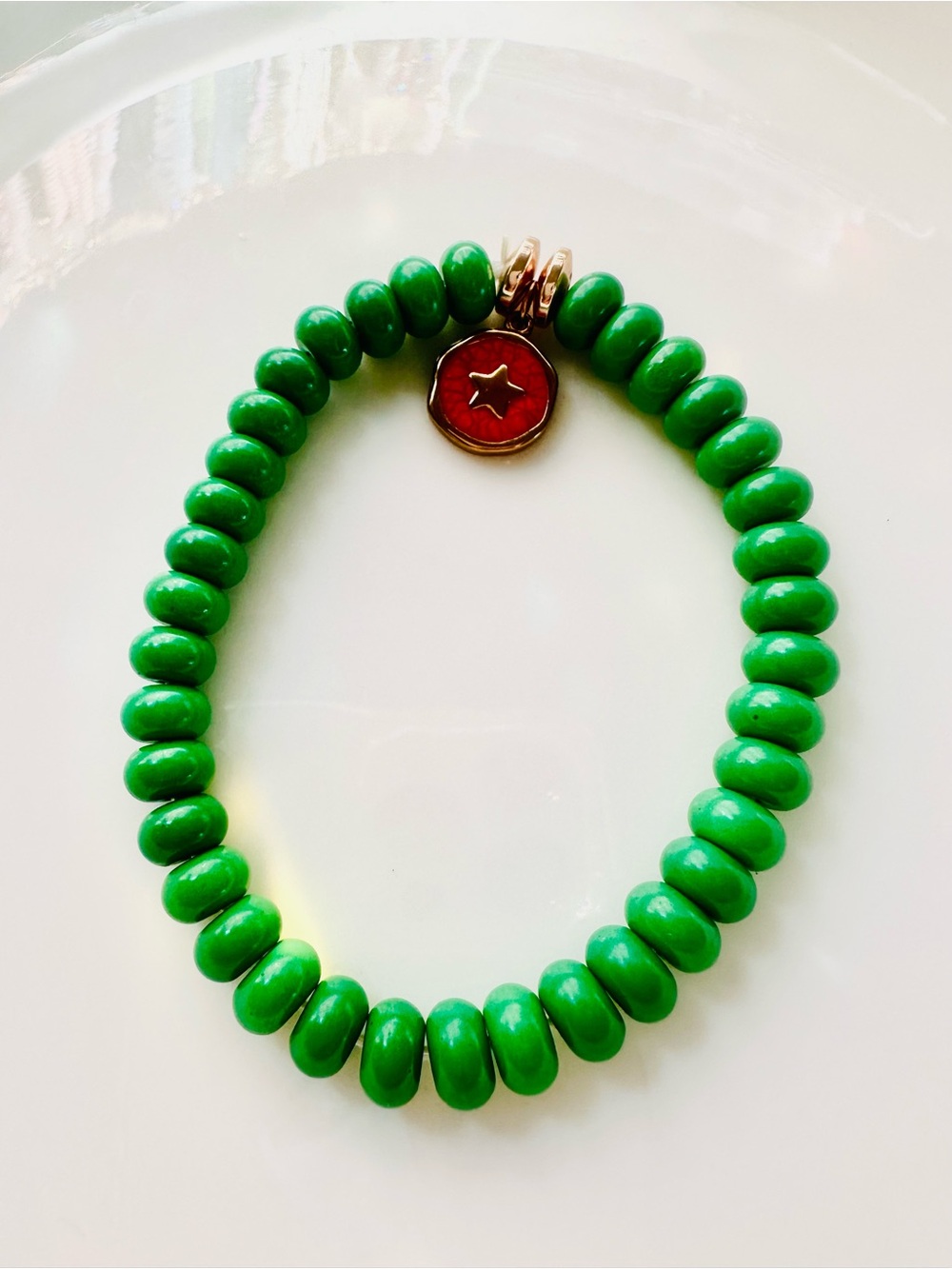 Bright Green Beaded Stretch Bracelet with Red Star Charm